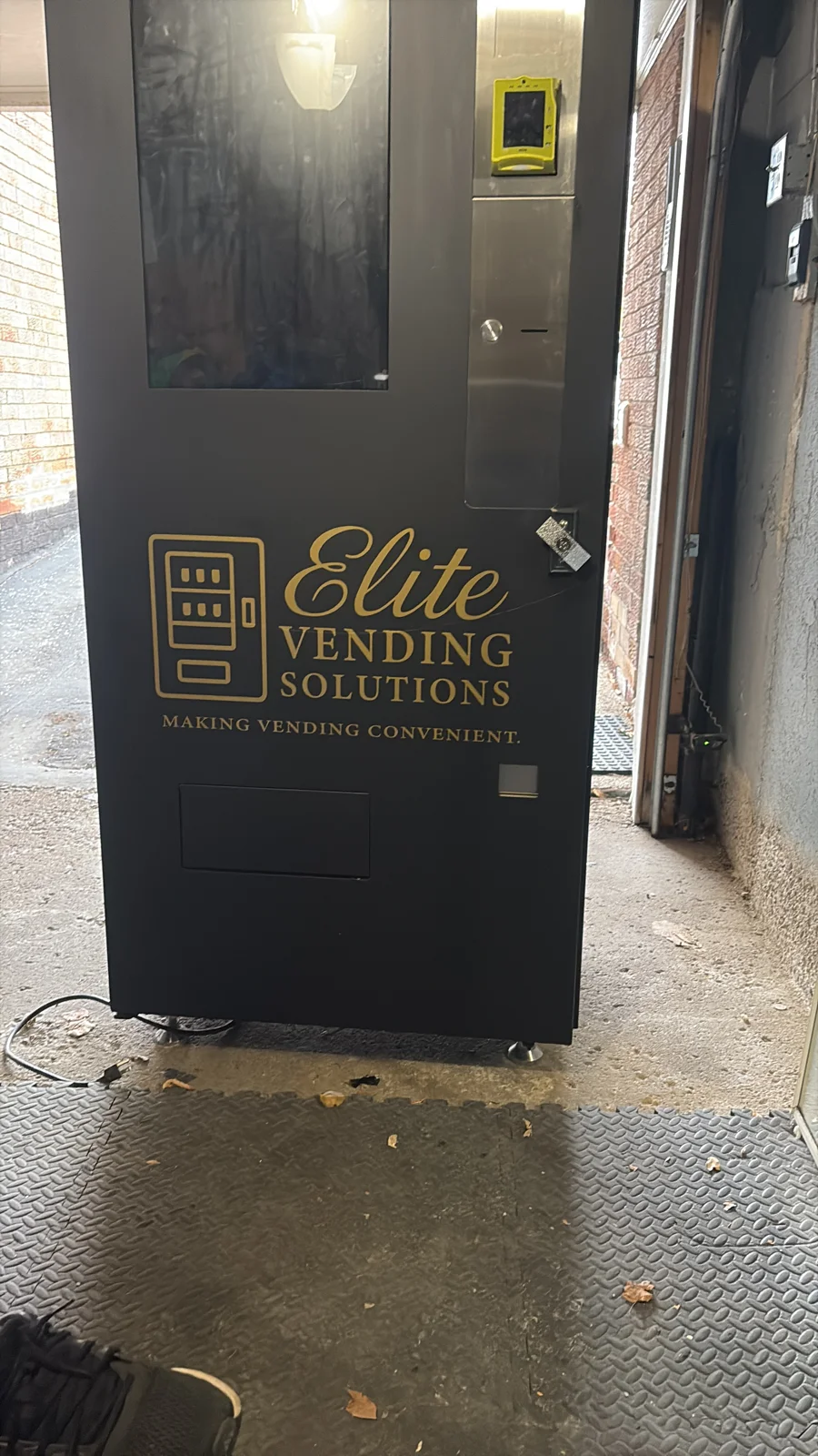 A freestanding Elite-branded vending machine